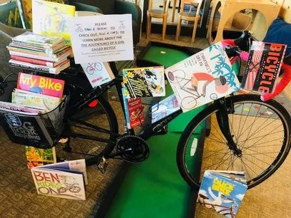bicycle-covered-with-books.webp